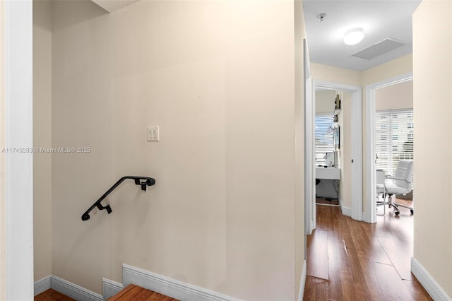 bathroom featuring baseboards, visible vents, and wood finished floors