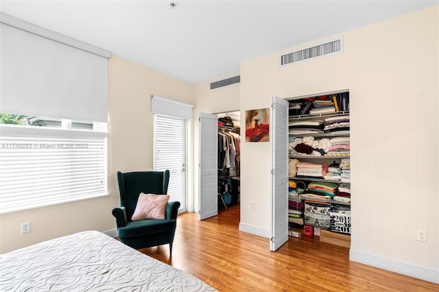 18408 NE 27th Ct Unit 18408, Aventura, FL 33160 - bedroom with light wood-style floors and a walk in closet