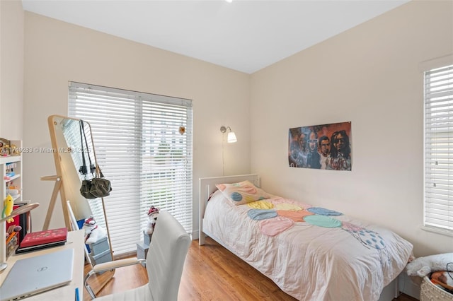 bedroom featuring wood finished floors