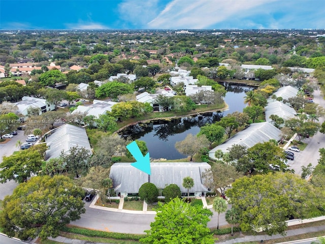 drone / aerial view featuring a water view and a residential view