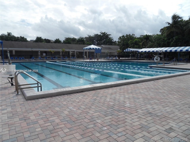 pool featuring a patio and fence