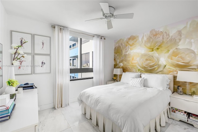 bedroom with marble finish floor, baseboards, and a ceiling fan