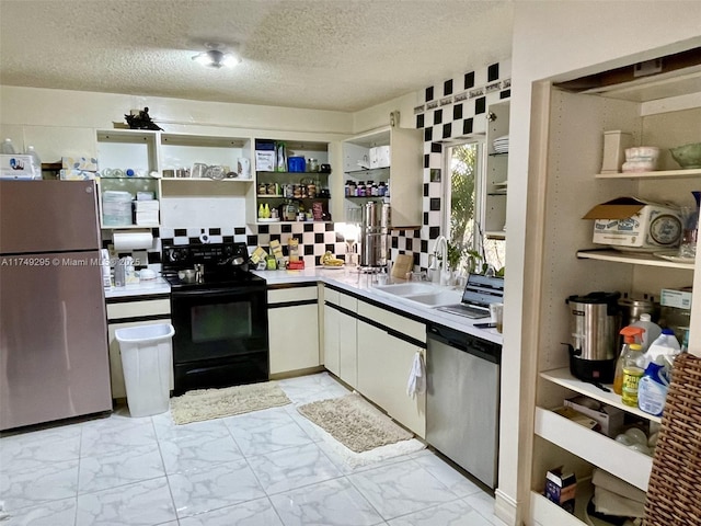 kitchen featuring a sink, black electric range, marble finish floor, freestanding refrigerator, and dishwasher