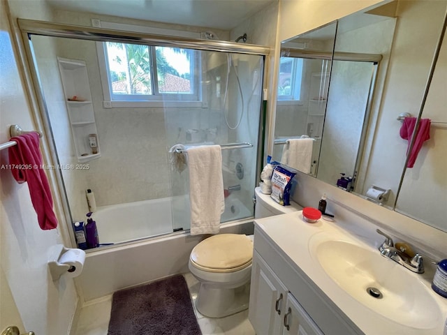 bathroom featuring combined bath / shower with glass door, vanity, and toilet