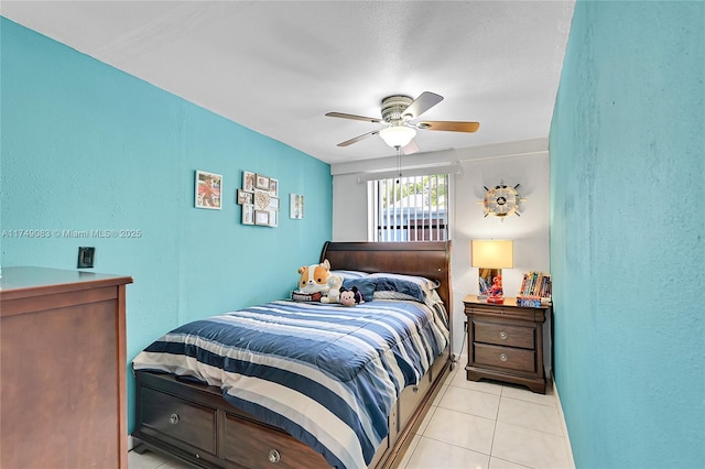 bedroom featuring a ceiling fan and light tile patterned flooring