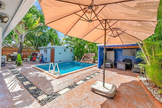 view of pool with a fenced in pool, a patio area, and a fenced backyard