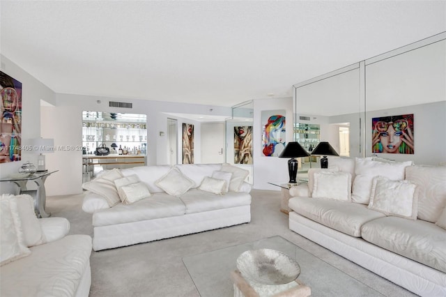carpeted living room with visible vents
