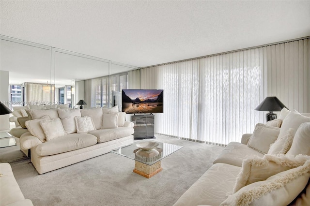 carpeted living room with a textured ceiling