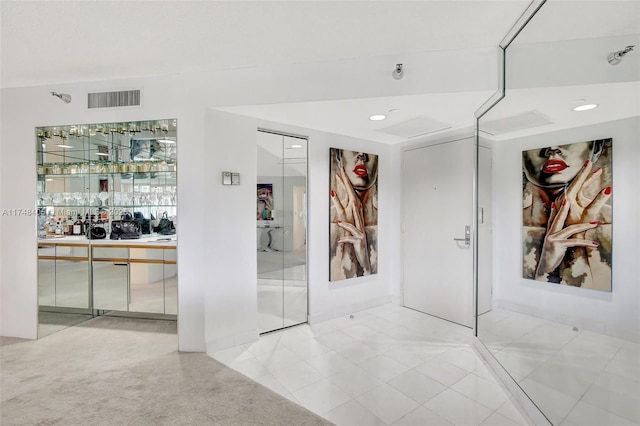 corridor with visible vents and recessed lighting