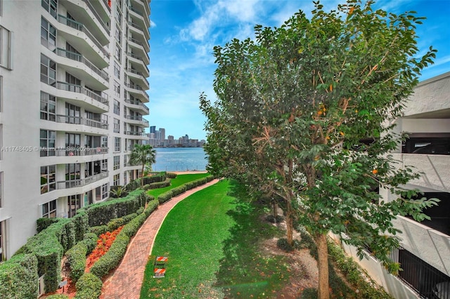 view of property's community with a view of city and a water view