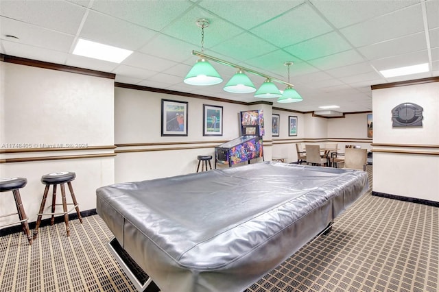 rec room with a paneled ceiling, pool table, ornamental molding, carpet flooring, and baseboards