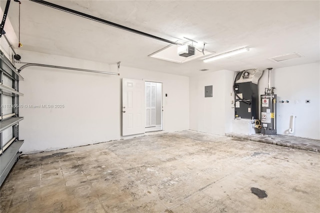 garage featuring heating unit, electric panel, gas water heater, and a garage door opener