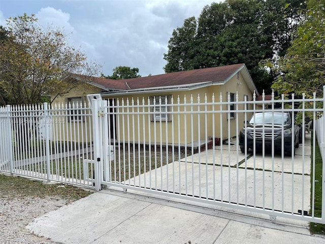 view of gate featuring fence