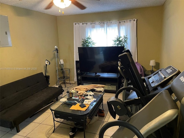 120 NE 75th St, Miami, FL 33138 - living area featuring light tile patterned floors, ceiling fan, electric panel, and a textured ceiling