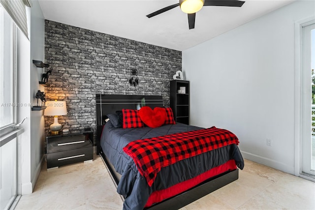 bedroom featuring ceiling fan and baseboards