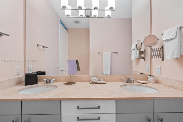 bathroom with a sink and double vanity