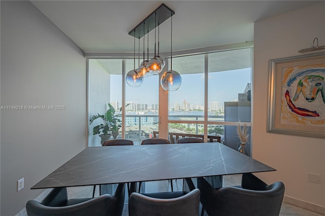 18201 Collins Ave Unit 1201, Sunny Isles Beach, FL 33160 - dining space featuring a city view, a chandelier, and baseboards