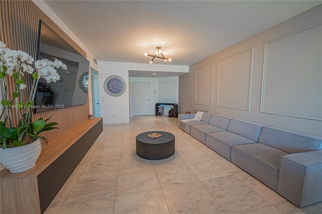 18201 Collins Ave Unit 1201, Sunny Isles Beach, FL 33160 - living area featuring a chandelier and marble finish floors