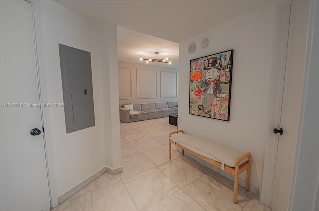 18201 Collins Ave Unit 1201, Sunny Isles Beach, FL 33160 - hall with electric panel, light marble finish flooring, and a chandelier