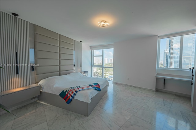 18201 Collins Ave Unit 1201, Sunny Isles Beach, FL 33160 - bedroom featuring light marble finish flooring and baseboards