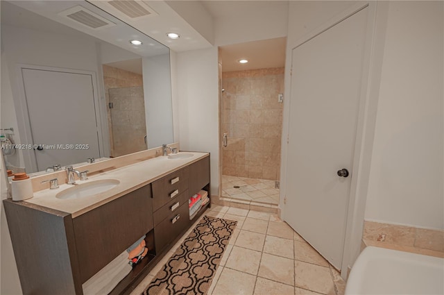 18201 Collins Ave Unit 1201, Sunny Isles Beach, FL 33160 - bathroom with a stall shower, double vanity, tile patterned floors, a bath, and recessed lighting