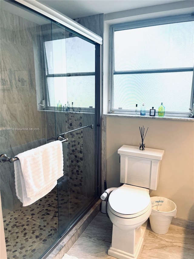 3800 Oaks Clubhouse Dr Unit 112, Pompano Beach, FL 33069 - full bathroom featuring plenty of natural light, toilet, a shower stall, and wood finished floors
