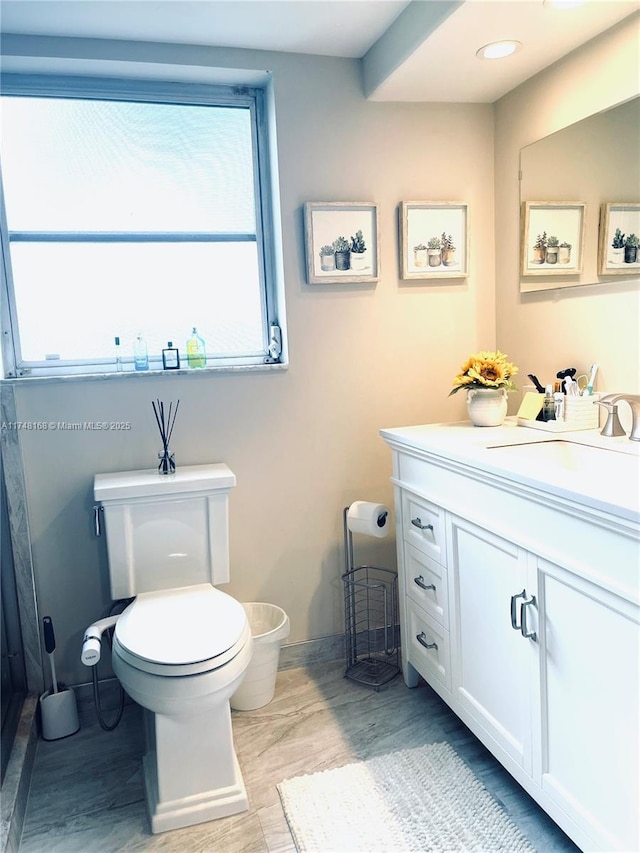 3800 Oaks Clubhouse Dr Unit 112, Pompano Beach, FL 33069 - bathroom featuring toilet, vanity, and wood finished floors