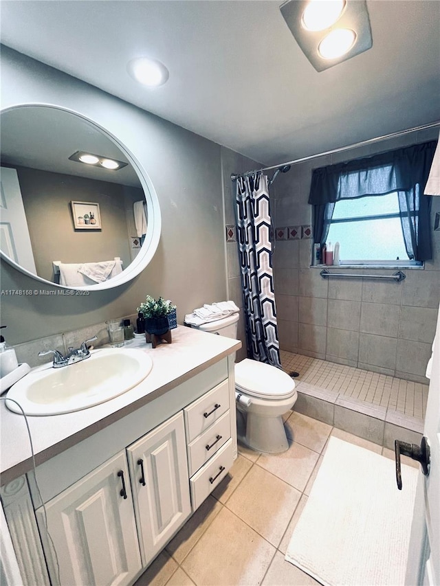3800 Oaks Clubhouse Dr Unit 112, Pompano Beach, FL 33069 - bathroom with tile patterned flooring, a shower stall, vanity, and toilet