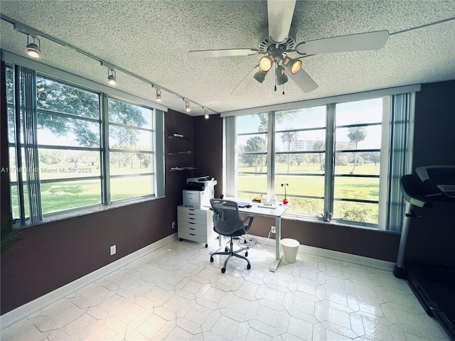 3800 Oaks Clubhouse Dr Unit 112, Pompano Beach, FL 33069 - tiled office featuring track lighting, a ceiling fan, a textured ceiling, and baseboards