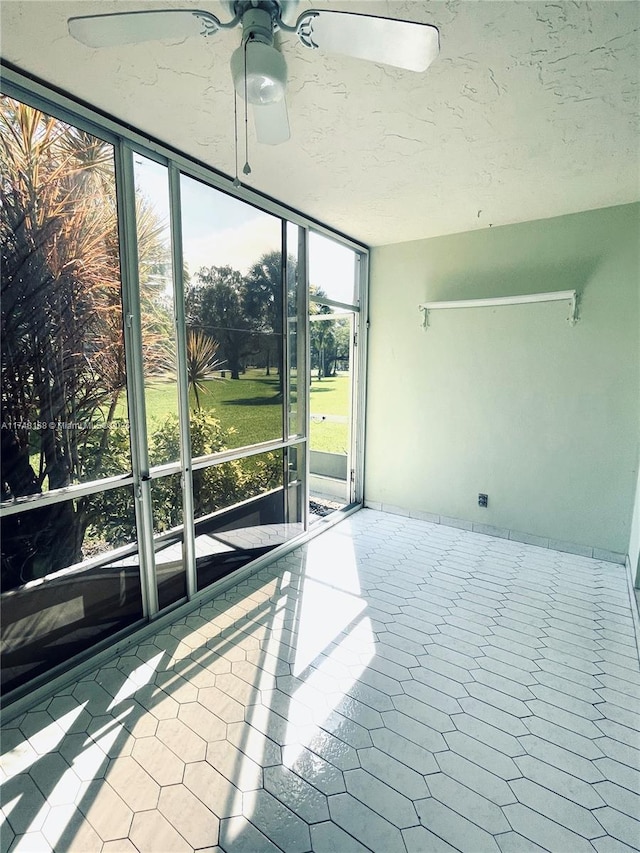3800 Oaks Clubhouse Dr Unit 112, Pompano Beach, FL 33069 - unfurnished sunroom featuring ceiling fan
