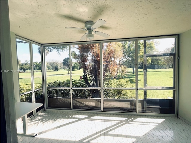3800 Oaks Clubhouse Dr Unit 112, Pompano Beach, FL 33069 - unfurnished sunroom featuring ceiling fan and plenty of natural light