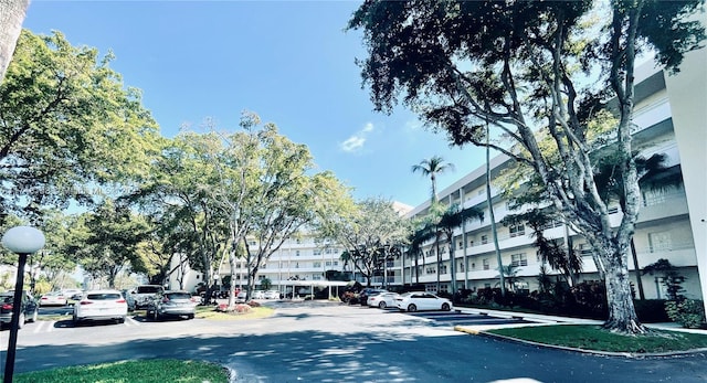 3800 Oaks Clubhouse Dr Unit 112, Pompano Beach, FL 33069 - view of asphalt street featuring street lighting