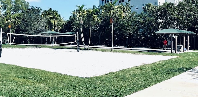 3800 Oaks Clubhouse Dr Unit 112, Pompano Beach, FL 33069 - view of property's community with volleyball court and a lawn