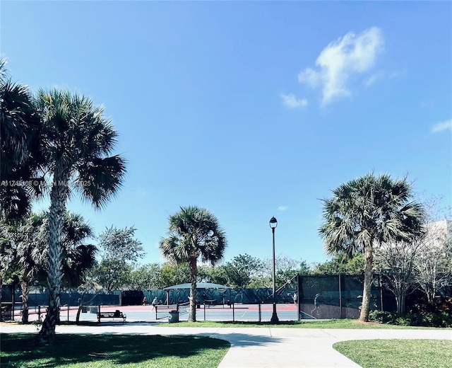 3800 Oaks Clubhouse Dr Unit 112, Pompano Beach, FL 33069 - surrounding community featuring a tennis court