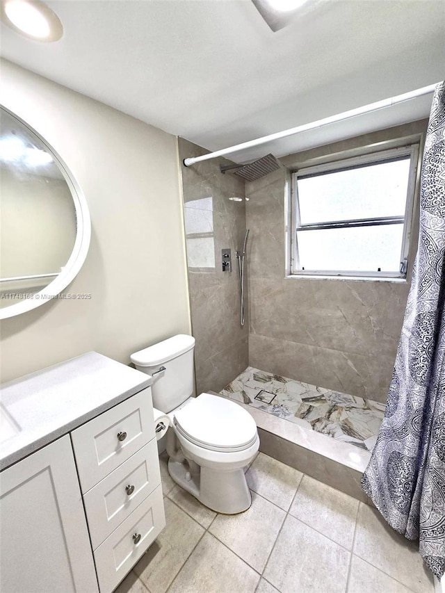 3800 Oaks Clubhouse Dr Unit 112, Pompano Beach, FL 33069 - bathroom with toilet, a tile shower, vanity, and tile patterned flooring