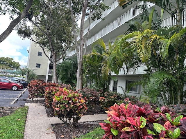 view of home's community featuring uncovered parking