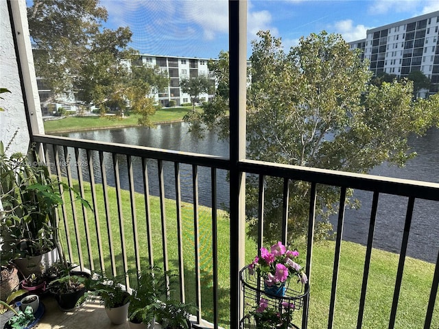 balcony featuring a water view