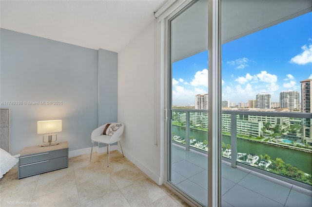 balcony with a view of city and a water view