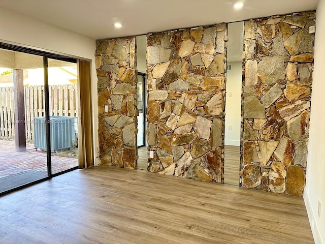 unfurnished room featuring recessed lighting and light wood-style floors