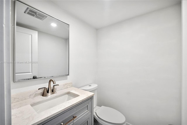 half bath with toilet and vanity