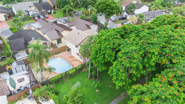 aerial perspective of suburban area featuring a pool