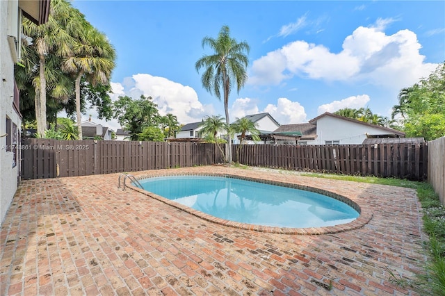 view of pool with a patio area and a fenced backyard