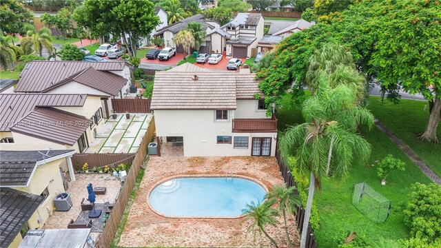 aerial perspective of suburban area featuring a pool area