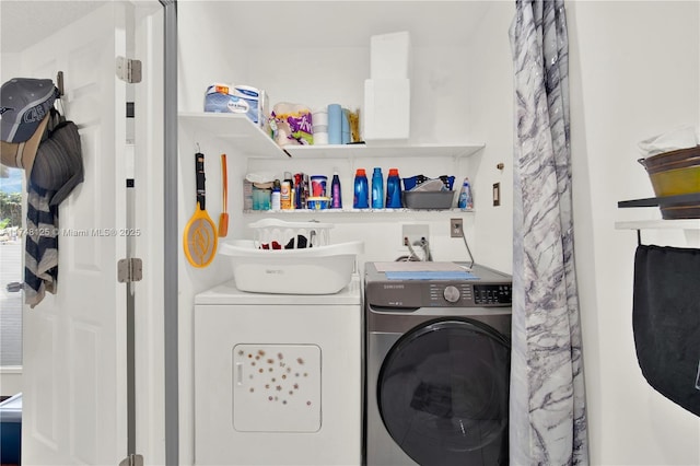 laundry area featuring laundry area and separate washer and dryer