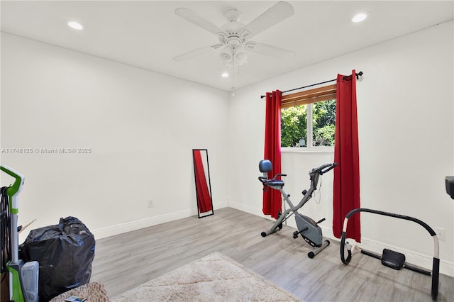 workout room with recessed lighting, ceiling fan, light wood-style flooring, and baseboards