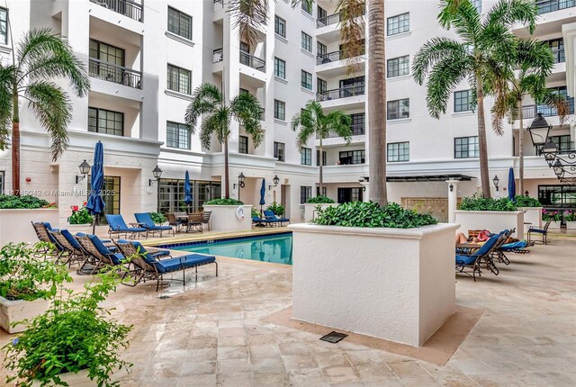 pool featuring a patio area