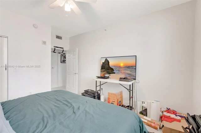 bedroom featuring ceiling fan and visible vents