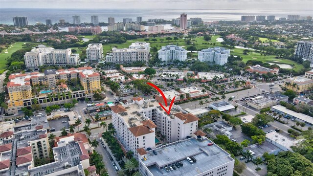 bird's eye view featuring a water view and a view of city