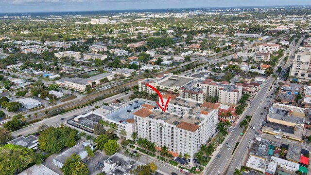 birds eye view of property featuring a city view