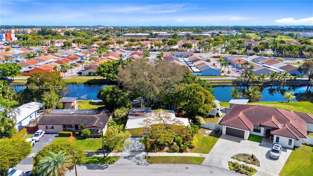 aerial view with a residential view and a water view